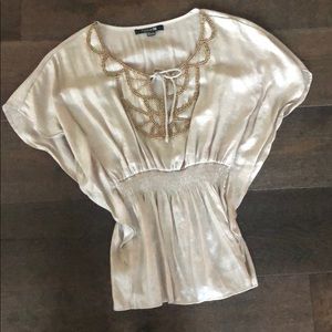 Beige blouse with beading